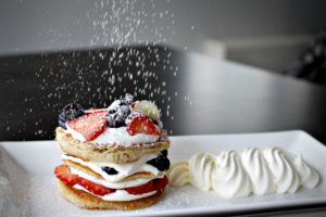Dining at Parade House in Monmouth - Pancake stack with fresh fruit, berries, and cream