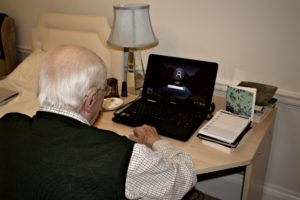Resident using superfast Fibre Broadband in his room at Parade House in Monmouth