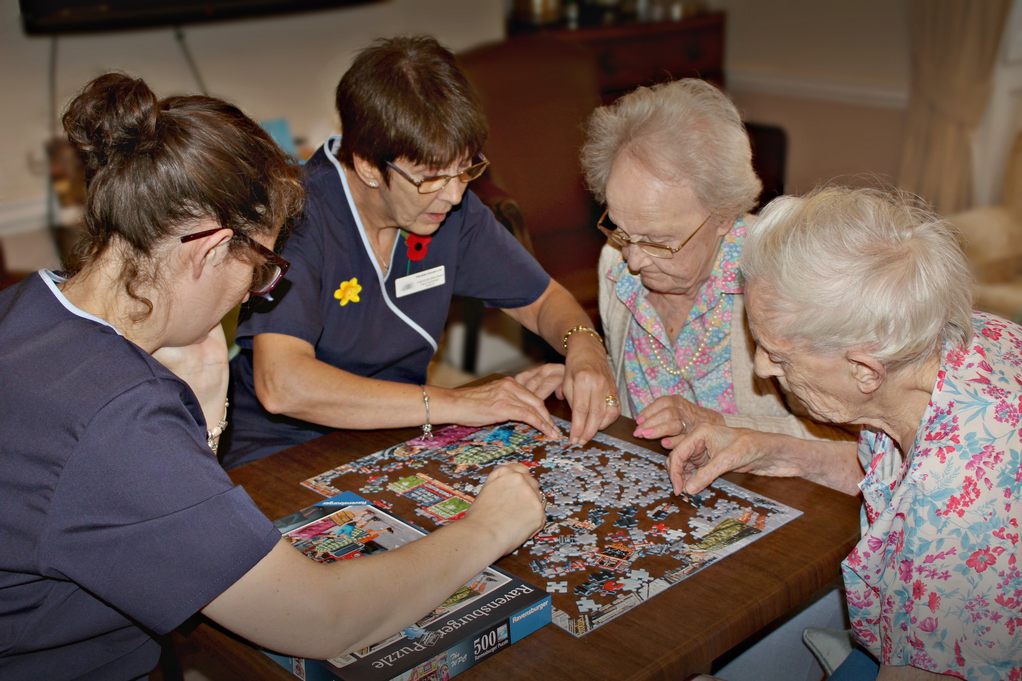 Parade House Activities - Staff and residents enjoying a puzzle at Parade House in Monmouth Parade House Activities - Staff and residents enjoying a puzzle at Parade House in Monmouth