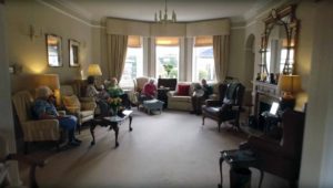 Residents relaxing in the comfortable lounge area at Parade House in Monmouth