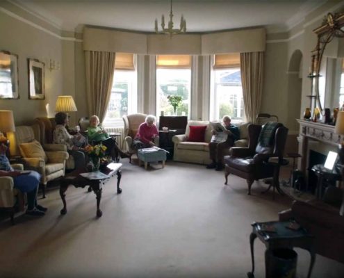 Residents relaxing in the comfortable lounge area at Parade House in Monmouth Residents relaxing in the comfortable lounge area at Parade House in Monmouth
