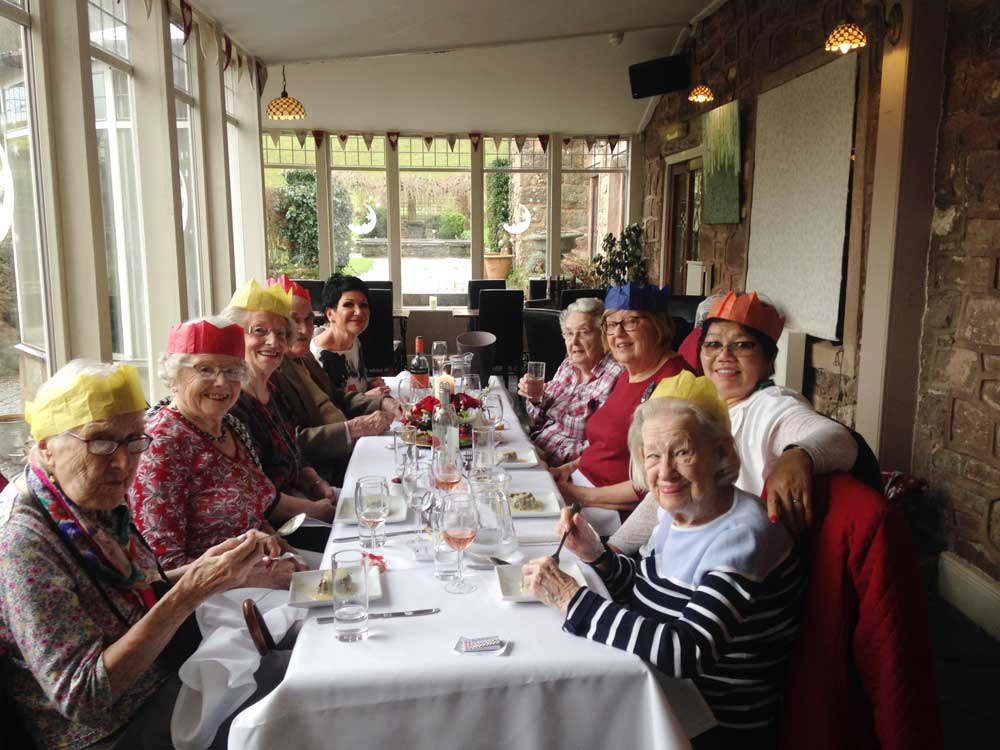 Staff and residents enjoying Christmas lunch at The Old Court Hotel.